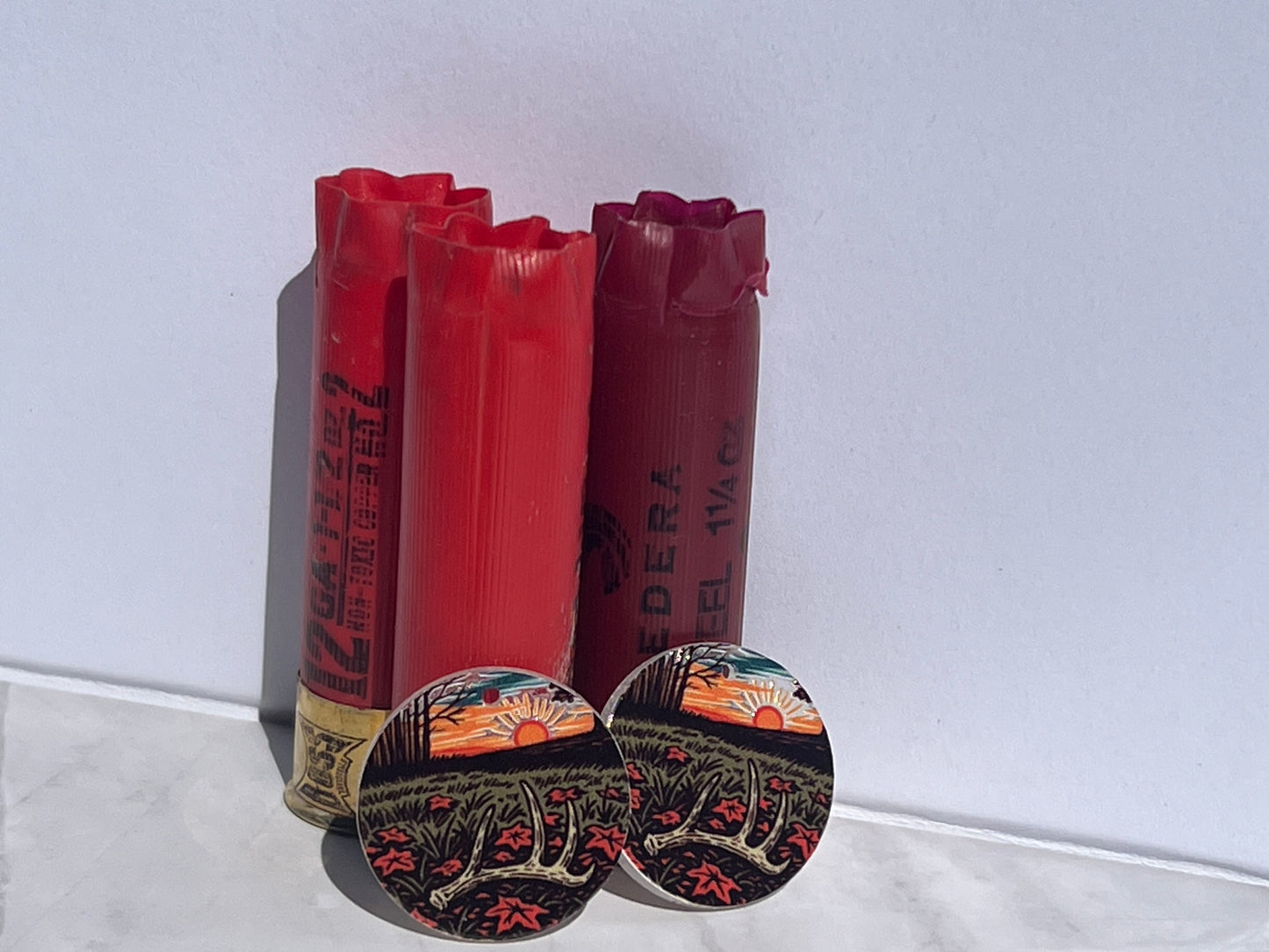 antler on ground with sunset on earring round acrylic piece